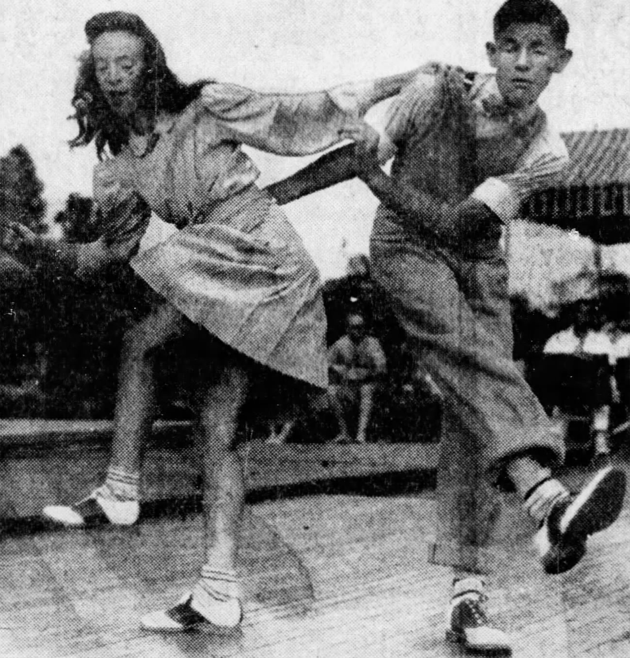A couple jitterbugging, around 1945